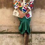 White denim overshirt embroidered with bright colors and pockets