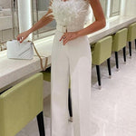 Margovil Off Shoulder Feather Splice Belted Jumpsuit