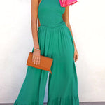 Solid color halter neck open back flared jumpsuit