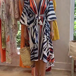 Margovil V Neck Lantern Sleeve Tie Waist Printed Irregular Swing Dress