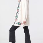Off-white knitted cardigan with embroidery detail