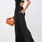 Solid color halter neck open back flared jumpsuit