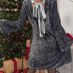 Sequined long-sleeved party dress with bow on the back