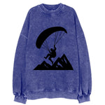 Paraglider soaring over mountain peaks - Vintage Sweatshirt