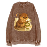 Otter weaving river reeds into a floating crown beside mirror-still water - Vintage Sweatshirt