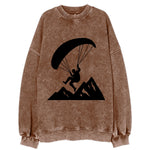 Paraglider soaring over mountain peaks - Vintage Sweatshirt