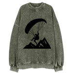 Paraglider soaring over mountain peaks - Vintage Sweatshirt
