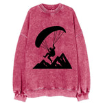 Paraglider soaring over mountain peaks - Vintage Sweatshirt