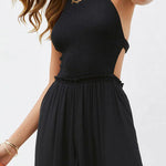 Solid color halter neck open back flared jumpsuit