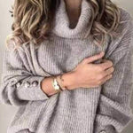High-neck button-decorated loose knit sweater