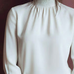 Elegant High Neck White Blouse With Smocked Cuffs And Ruffle Details